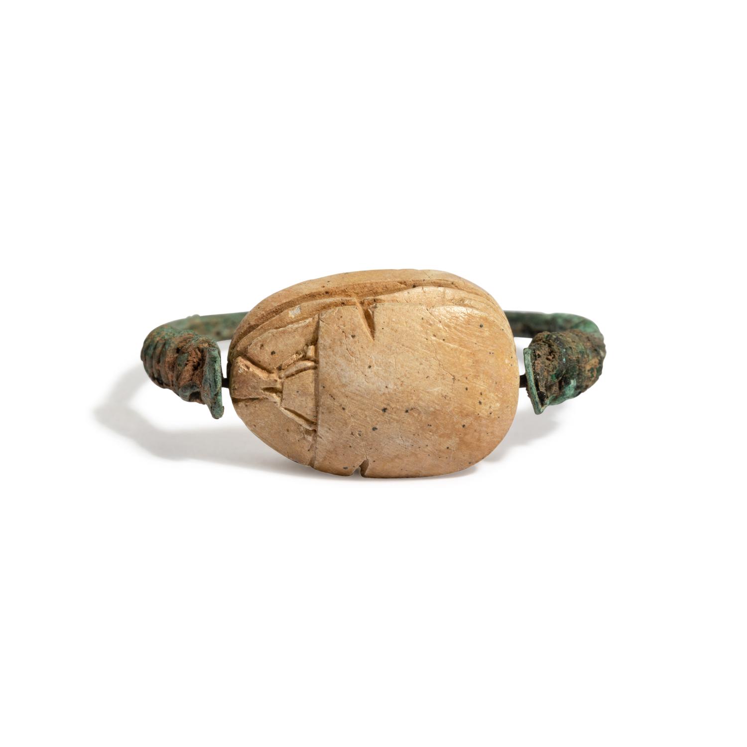 An Egyptian Bronze and 'Hyksos' Scarab Swivel Ring