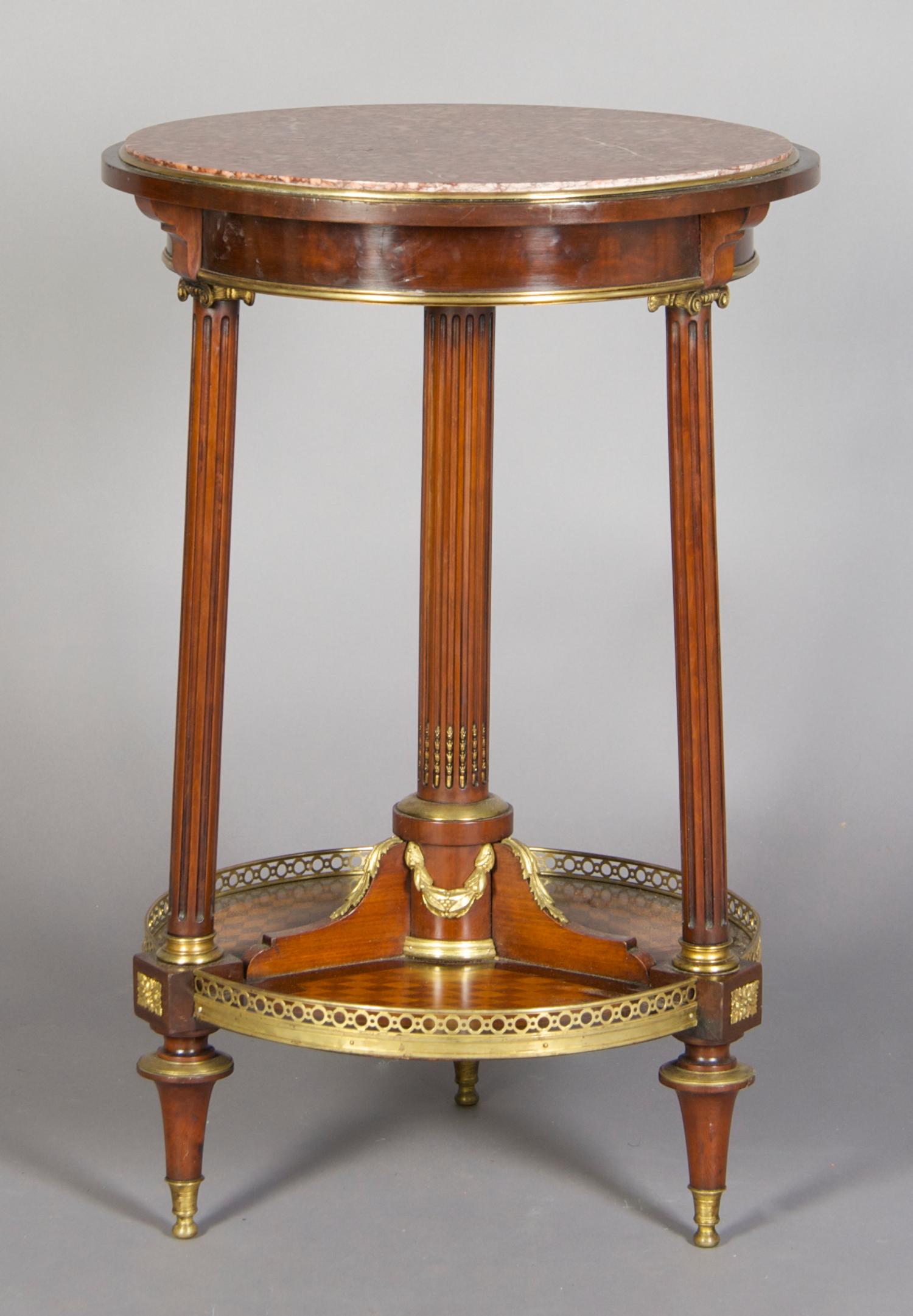 A French Gilt Metal Mounted Gueridon, Height 29 1/2 x diameter 19 1/2 inches.