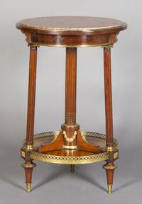 A French Gilt Metal Mounted Gueridon, Height 29 1/2 x diameter 19 1/2 inches.