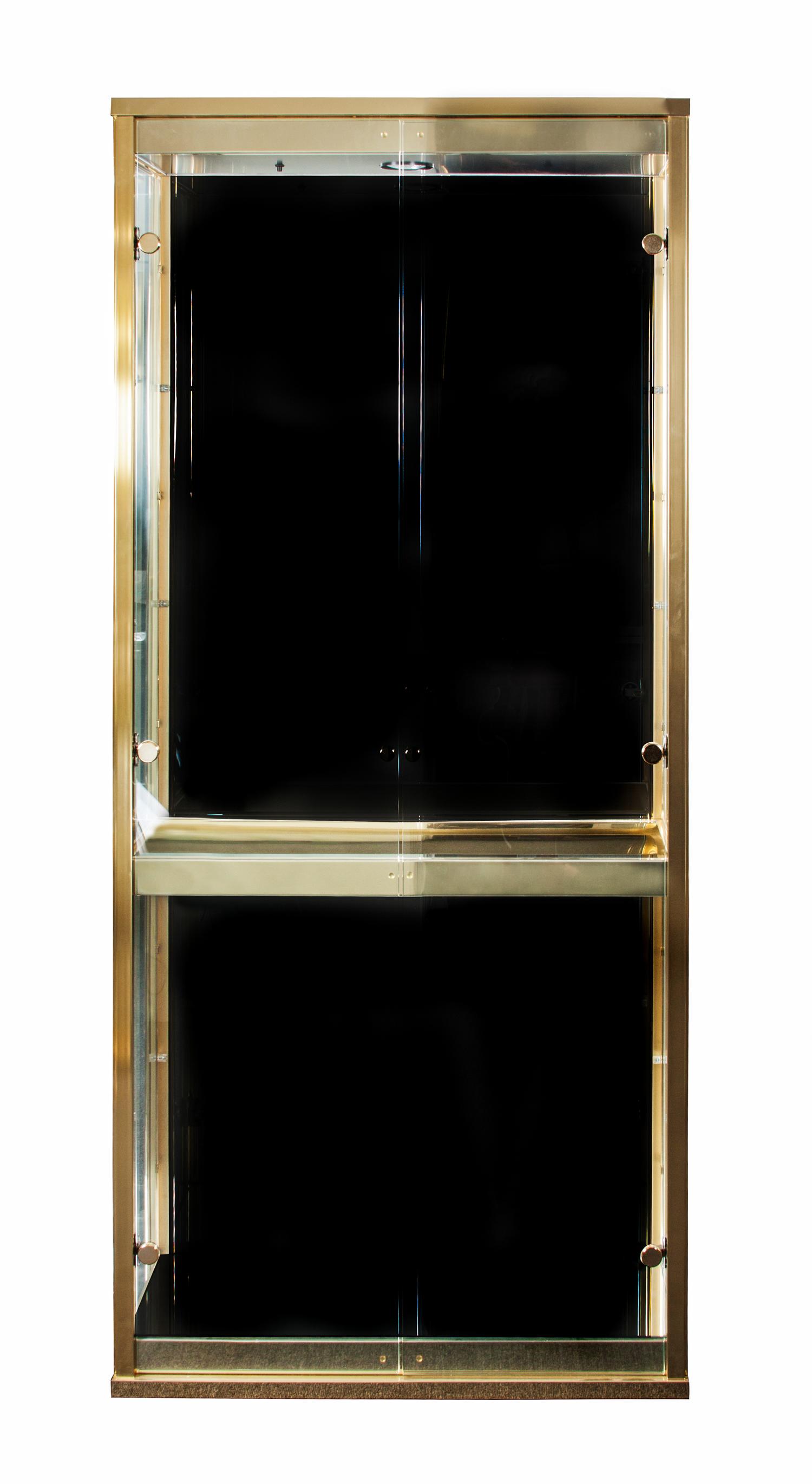 A Brass and Glass Vitrine Height 74 1/4 x width 33 x depth 13 1/2 inches. — SECOND HALF OF 20TH CENTURY