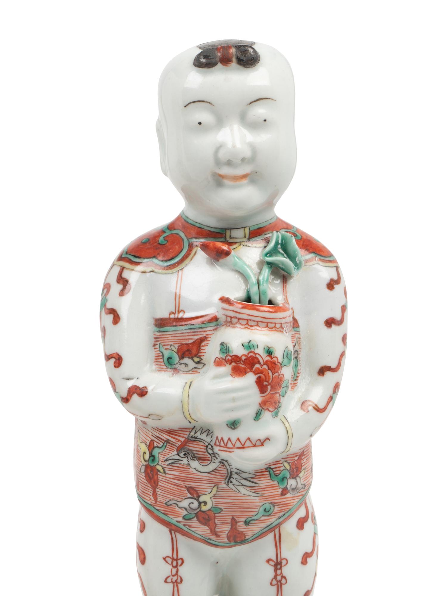 A Pair of Chinese Export Porcelain Models of Standing Boys