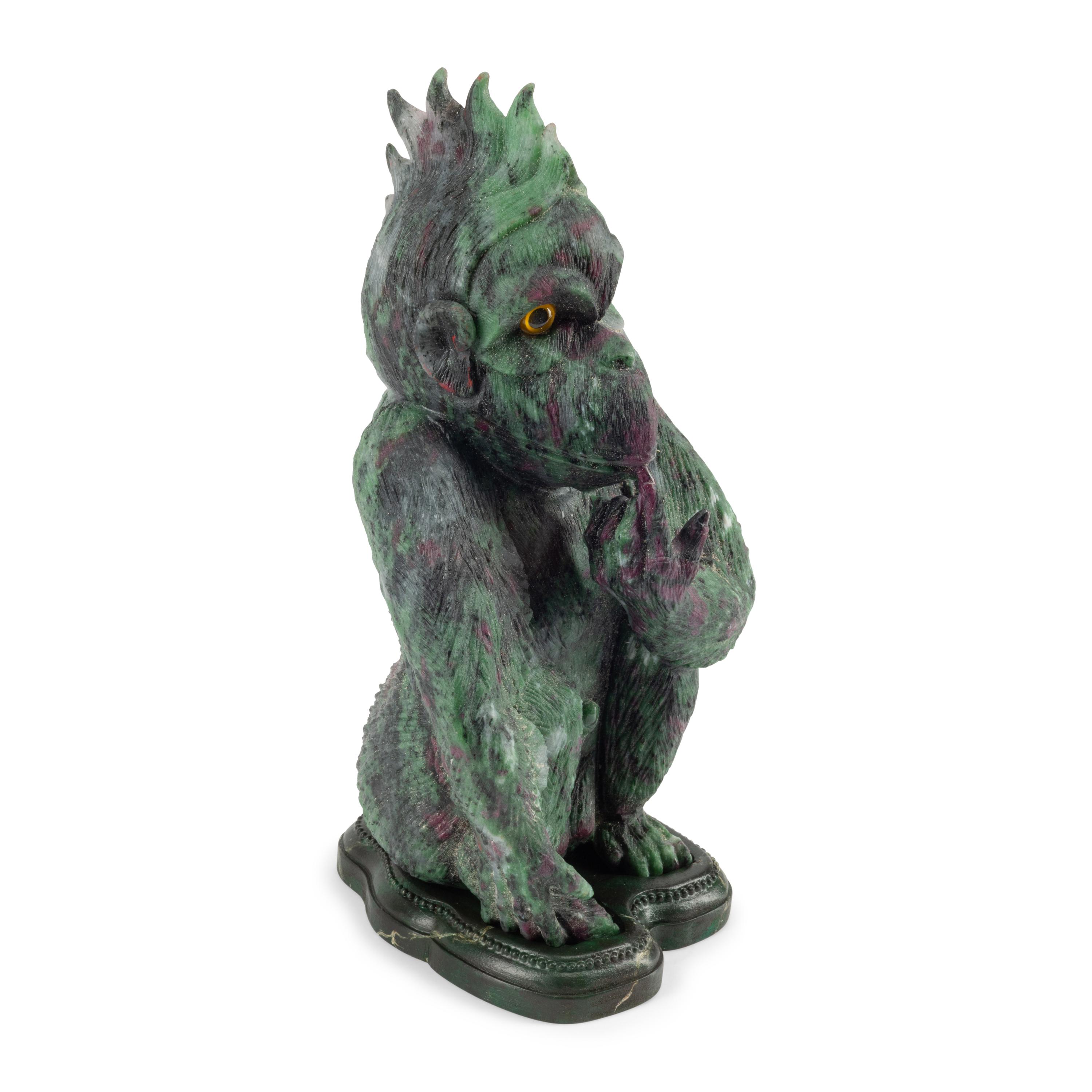 A Carved Ruby Zoisite Figure of a Seated Monkey