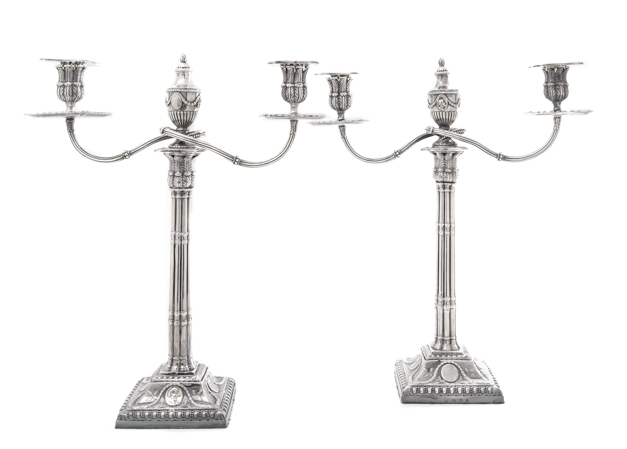A Pair of George III Silver Candelabra, Fenton Creswick & Co., Sheffield, 1779, each stem in the form of addorsed columns raised on a s