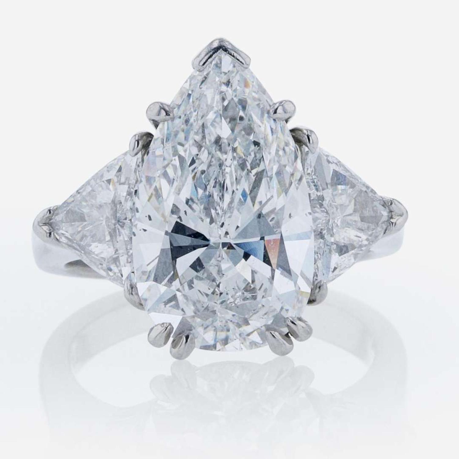 Three-Stone Diamond and Platinum Ring 5.97 Carat Pear-Shape Diamond, GIA Certified