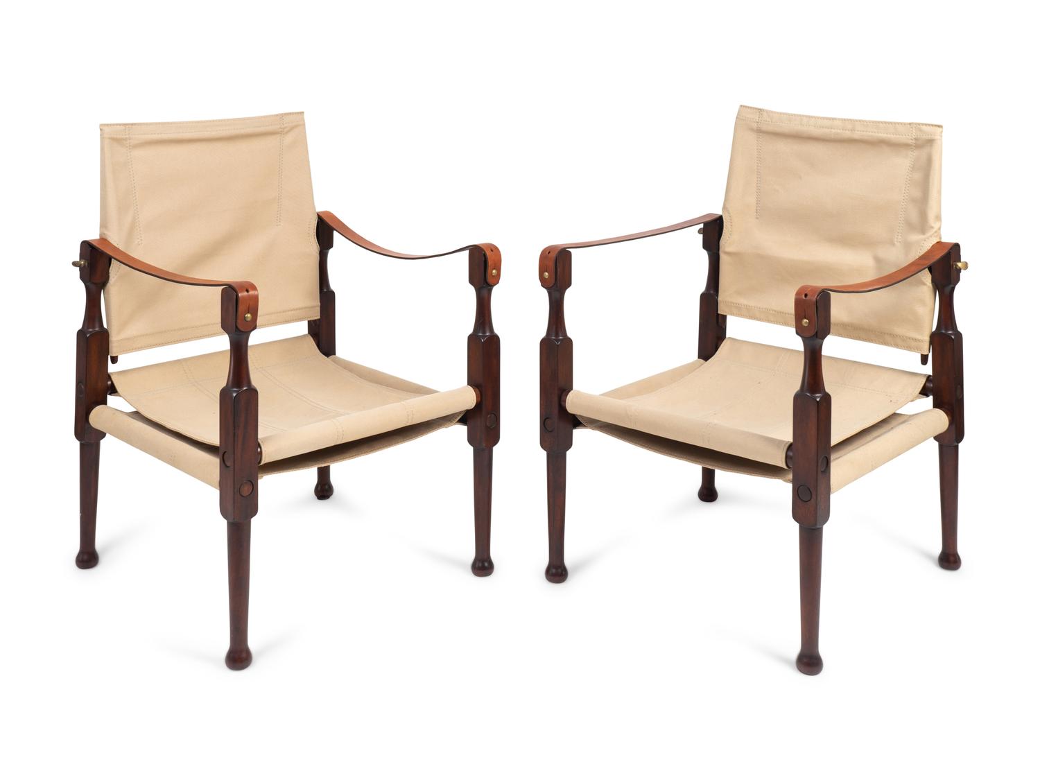 A Pair of British Colonial Style Mahogany, Canvas and Leather Strap Campaign Chairs — 20TH CENTURY