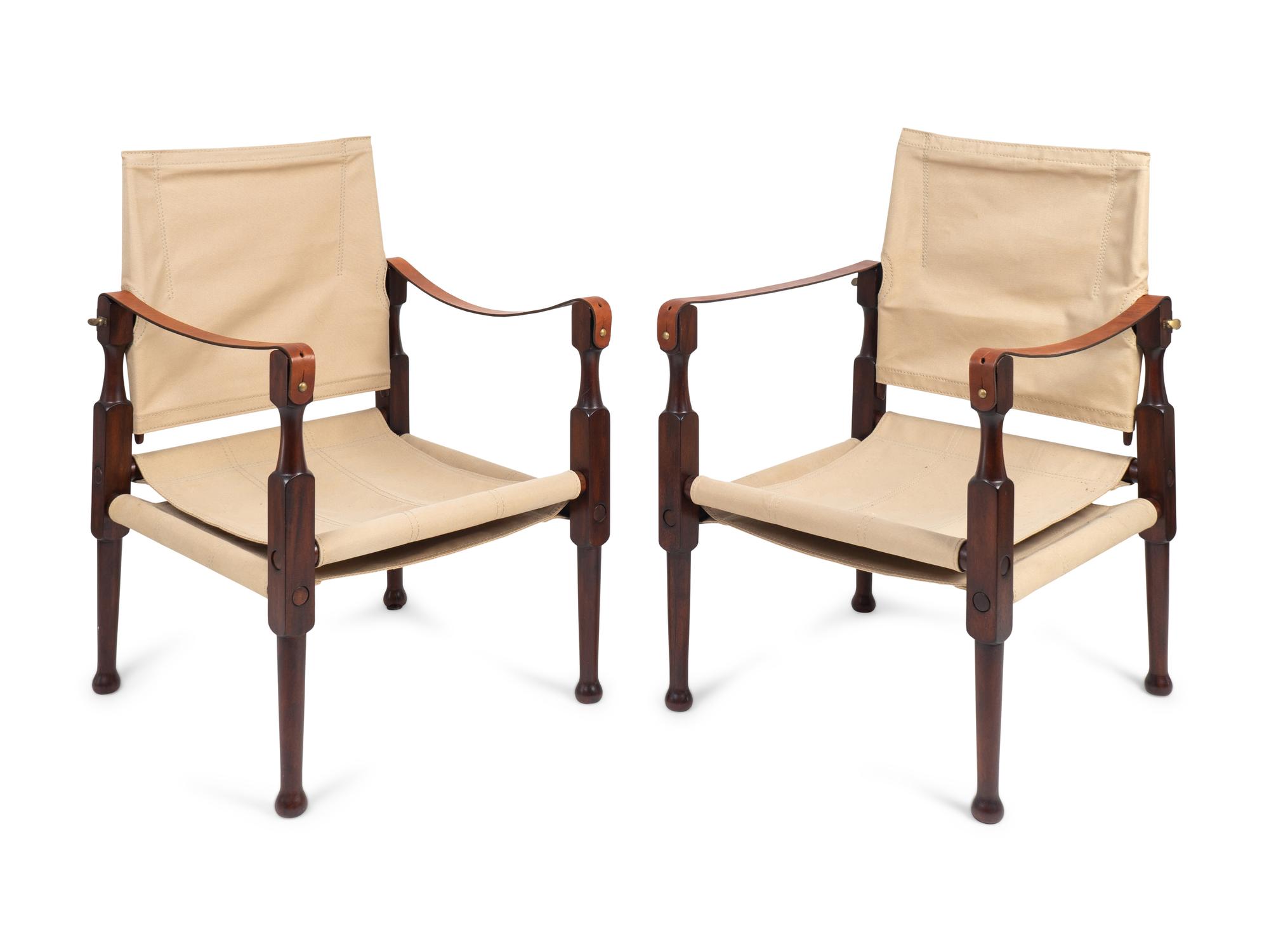 A Pair of British Colonial Style Mahogany, Canvas and Leather Strap Campaign Chairs — 20TH CENTURY