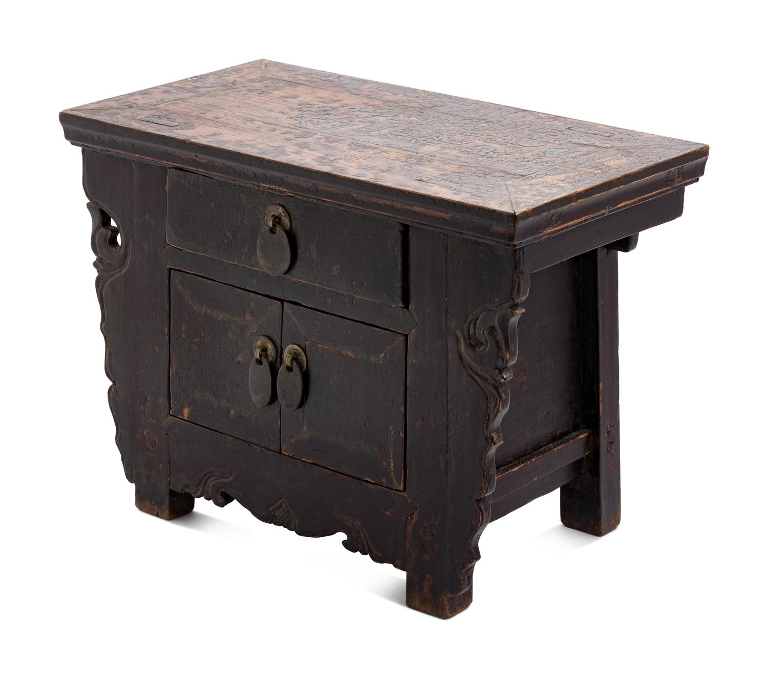 A Chinese Carved and Black Painted Wood Diminutive Chest