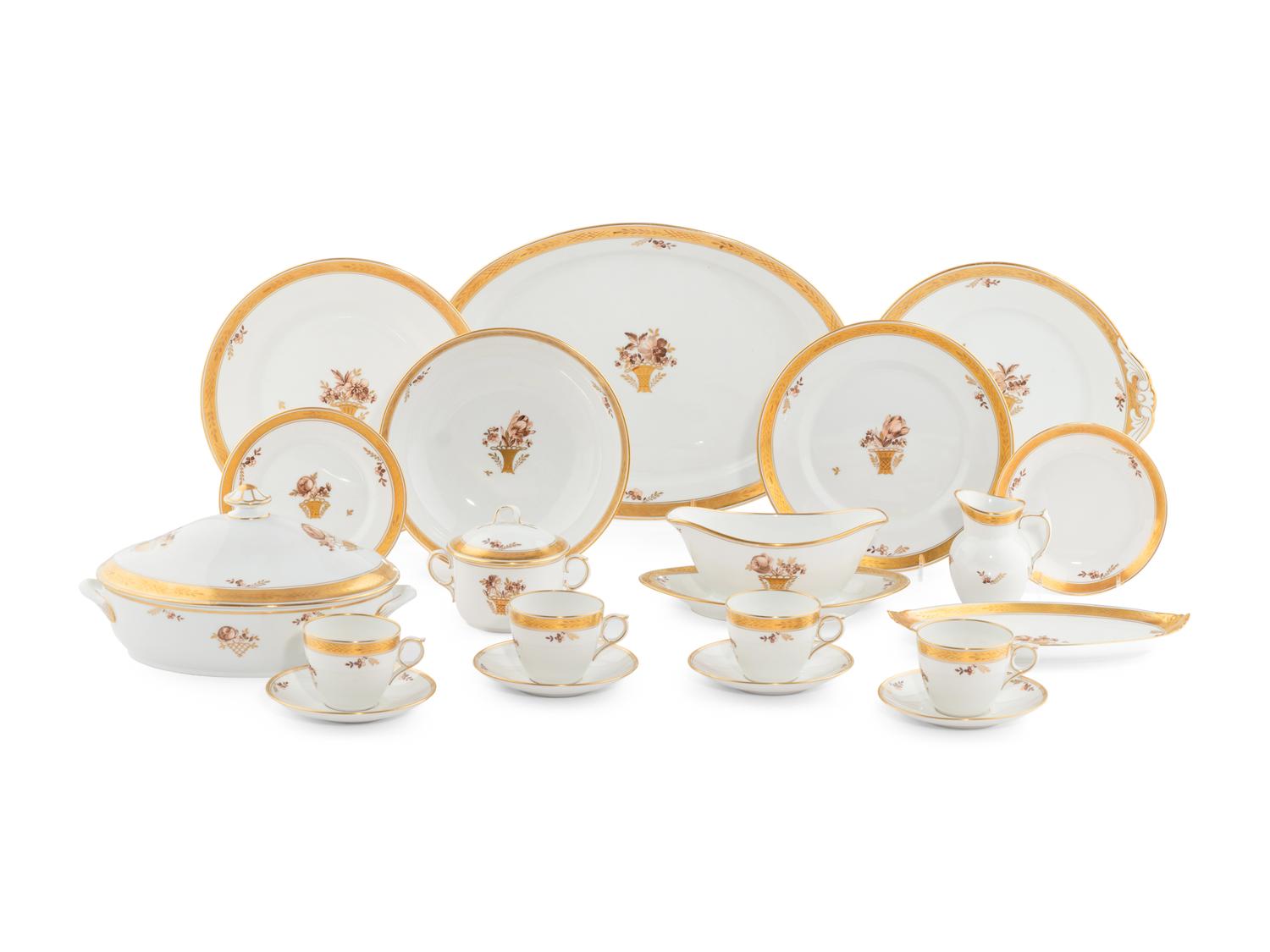 A Royal Copenhagen Golden Basket Porcelain Dinner Service