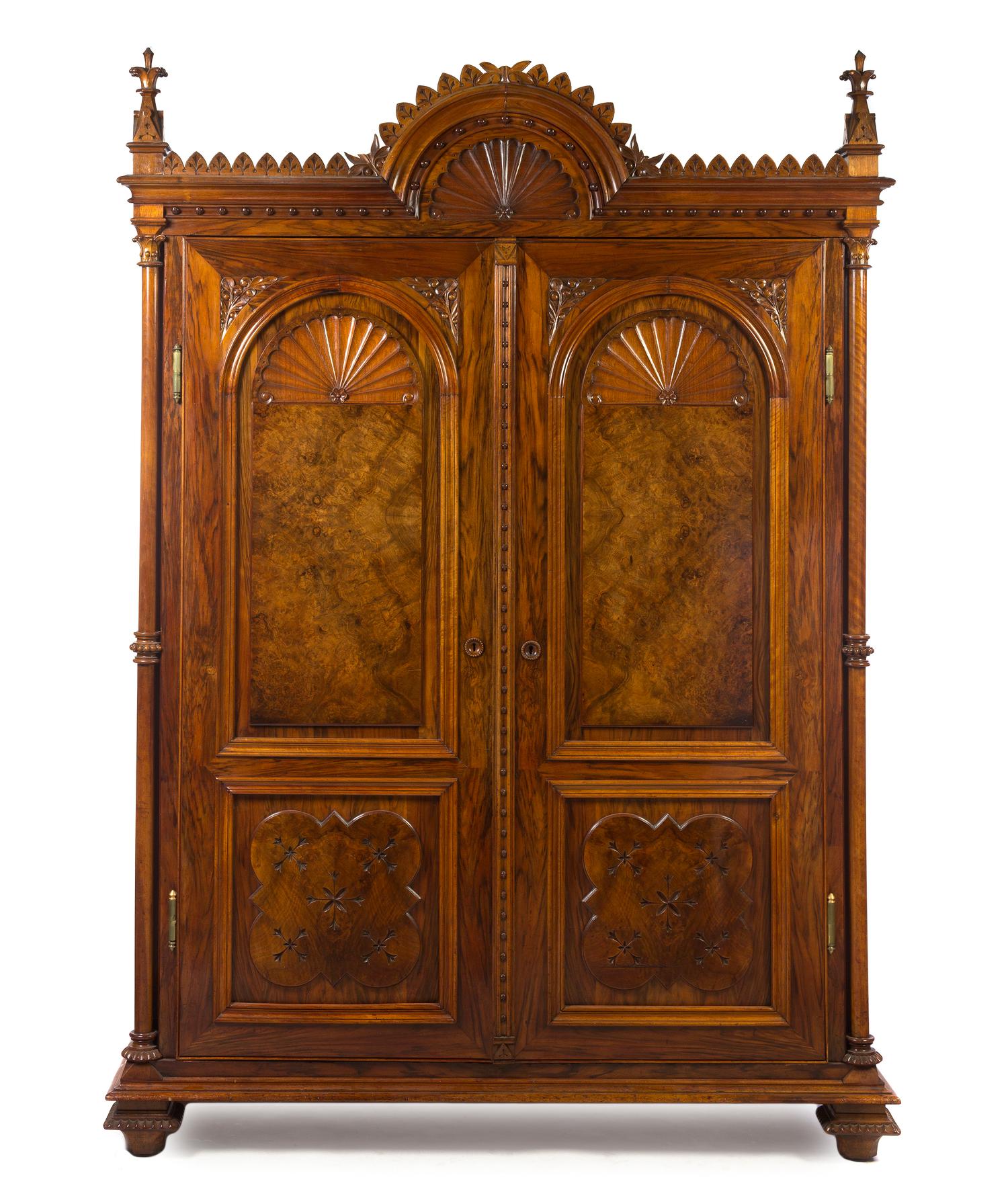 A Continental Gothic Revival Rosewood Armoire, Height 90 x width 64 1/4 x depth 25 1/2 inches.