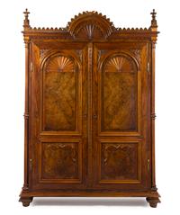 A Continental Gothic Revival Rosewood Armoire, Height 90 x width 64 1/4 x depth 25 1/2 inches.