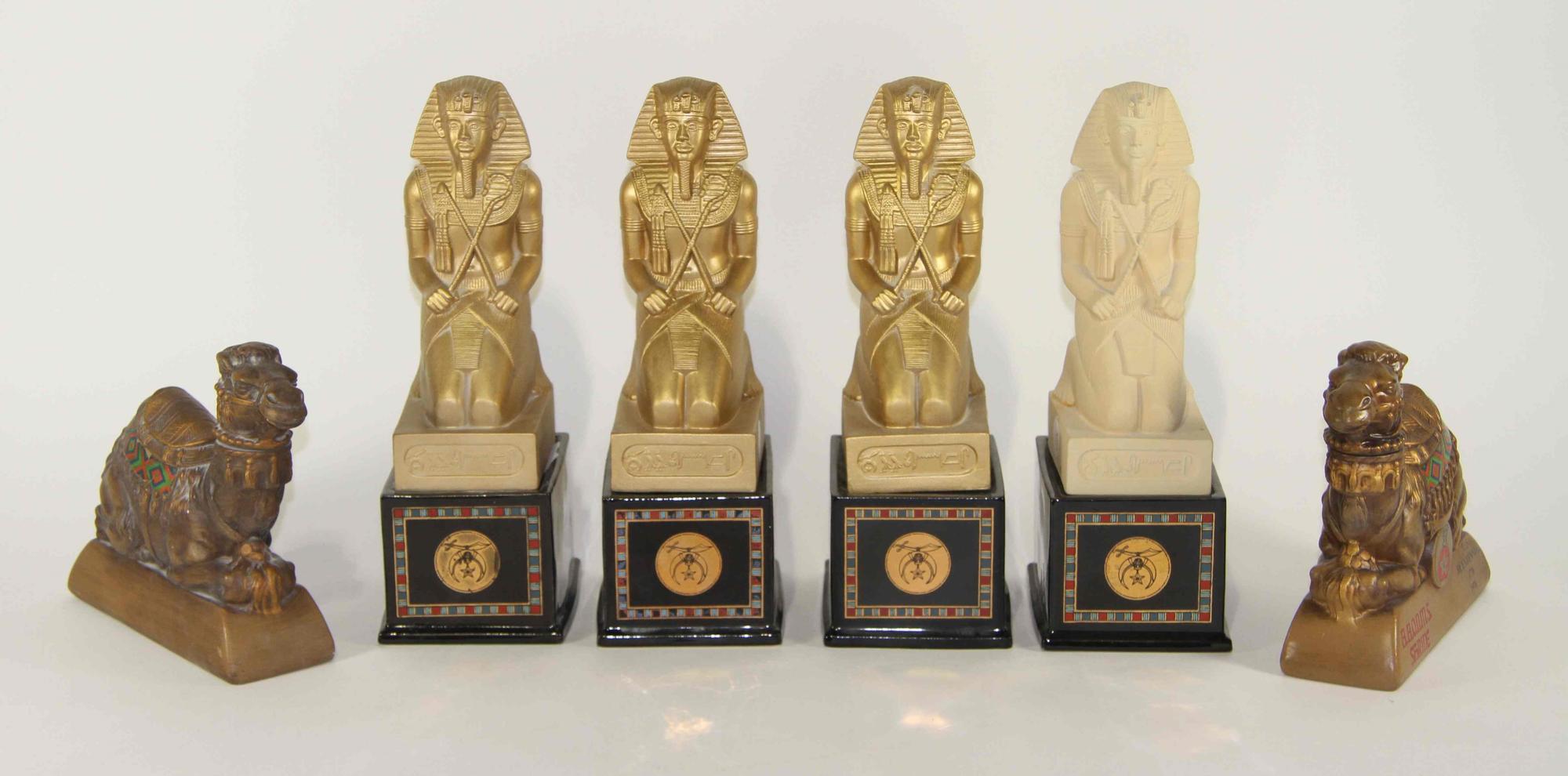 A Group of Six Pottery Figures Height of tallest overall 13 inches.