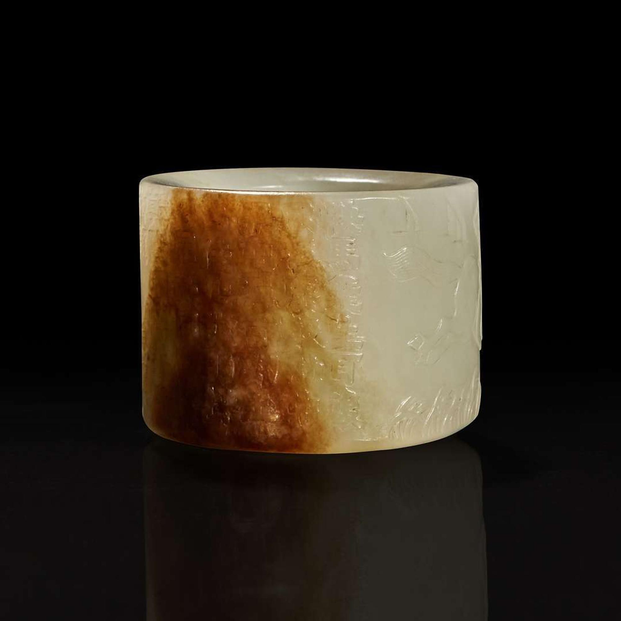 A large pale celadon and russet jade archer ring with Imperial poem and hunting scene 乾隆御题诗狩猎图玉扳指 Qing Dynasty ?