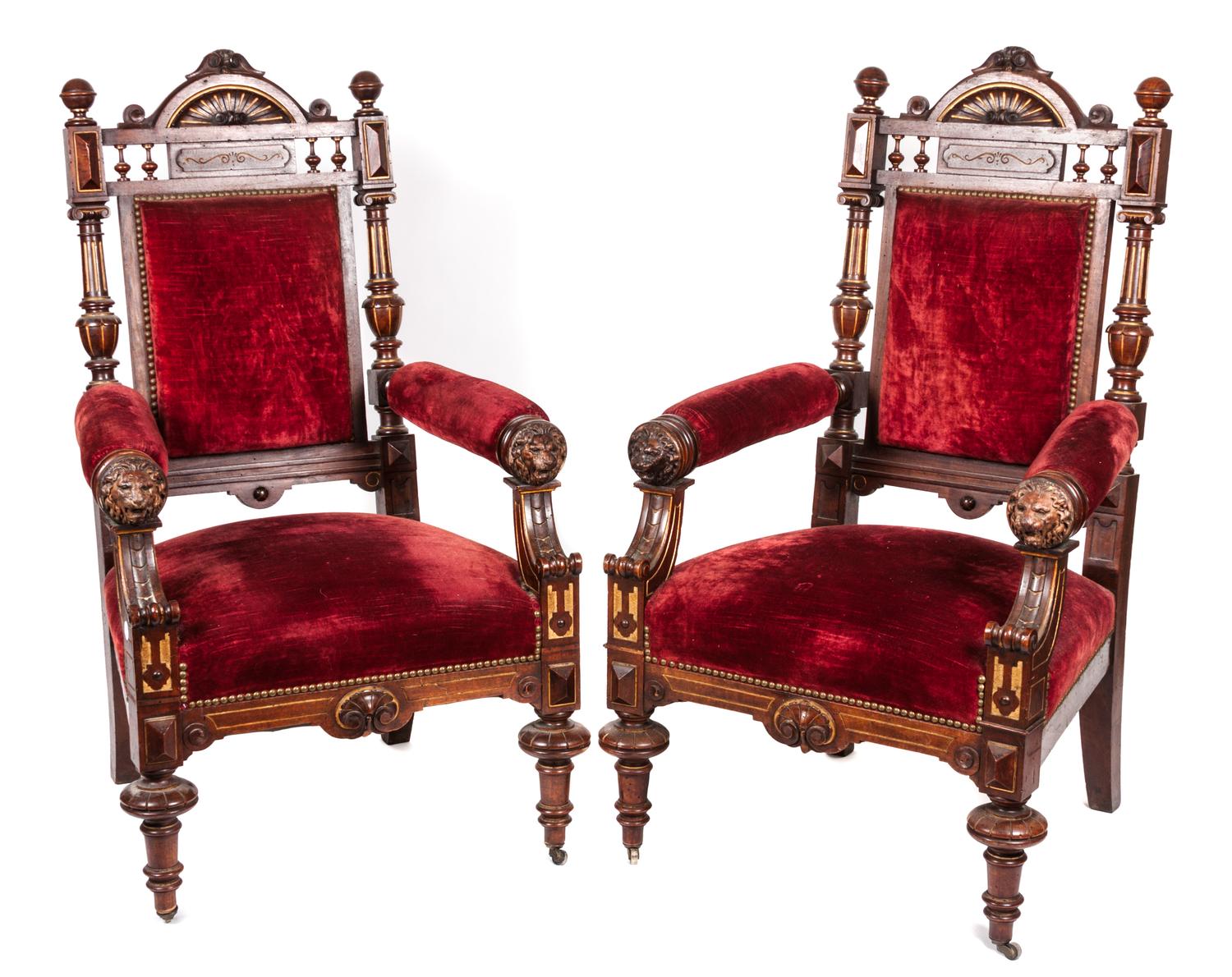A Pair of Victorian Ebonized Carved and Parcel Gilt Open Armchairs Height 46 inches.