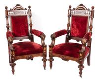 A Pair of Victorian Ebonized Carved and Parcel Gilt Open Armchairs Height 46 inches.