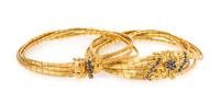 A Collection of 18 Karat Yellow Gold and Sapphire Bracelets, 36.40 dwts.