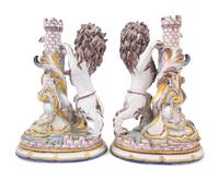A Pair of French Faience Lion Ornaments