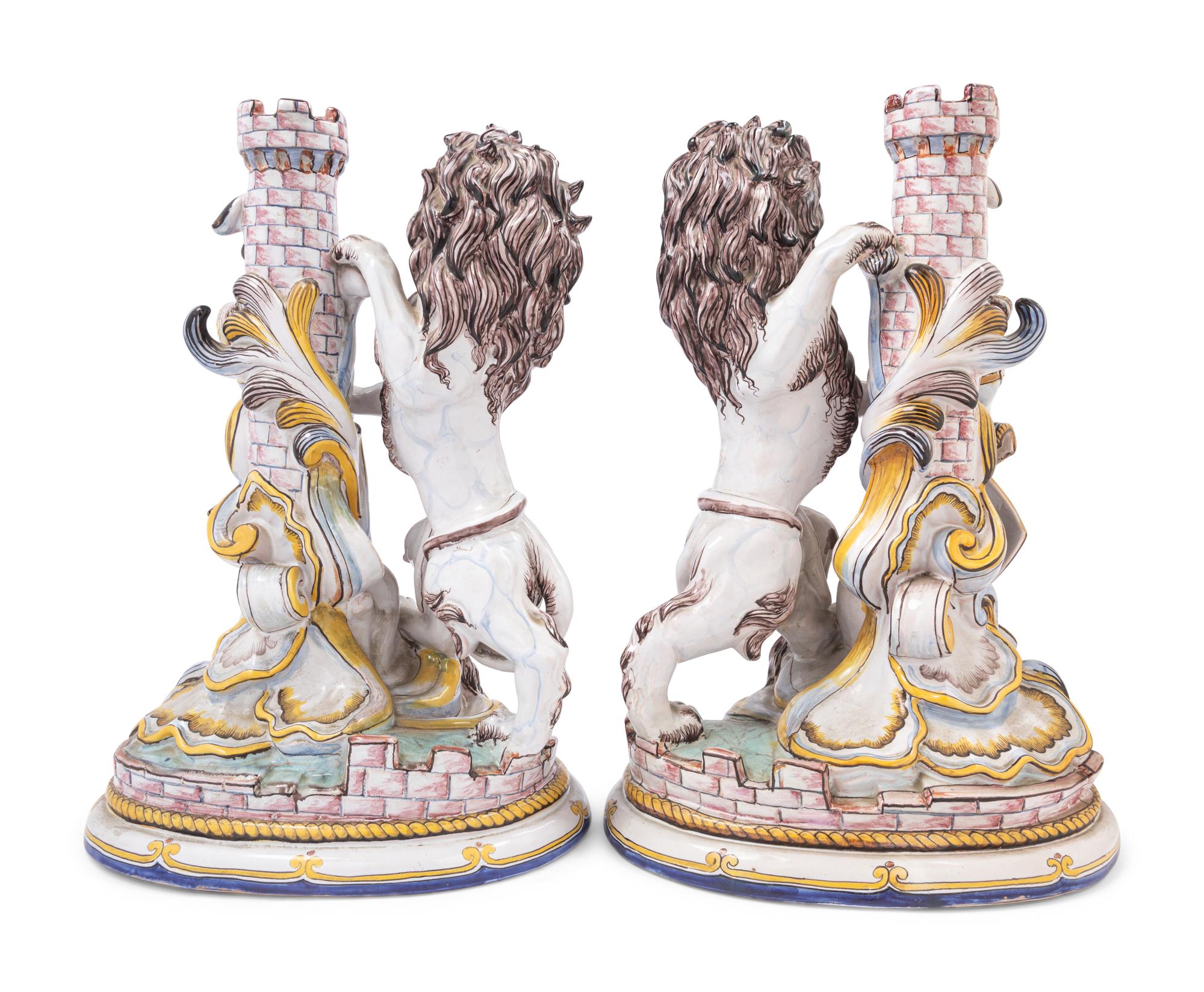 A Pair of French Faience Lion Ornaments