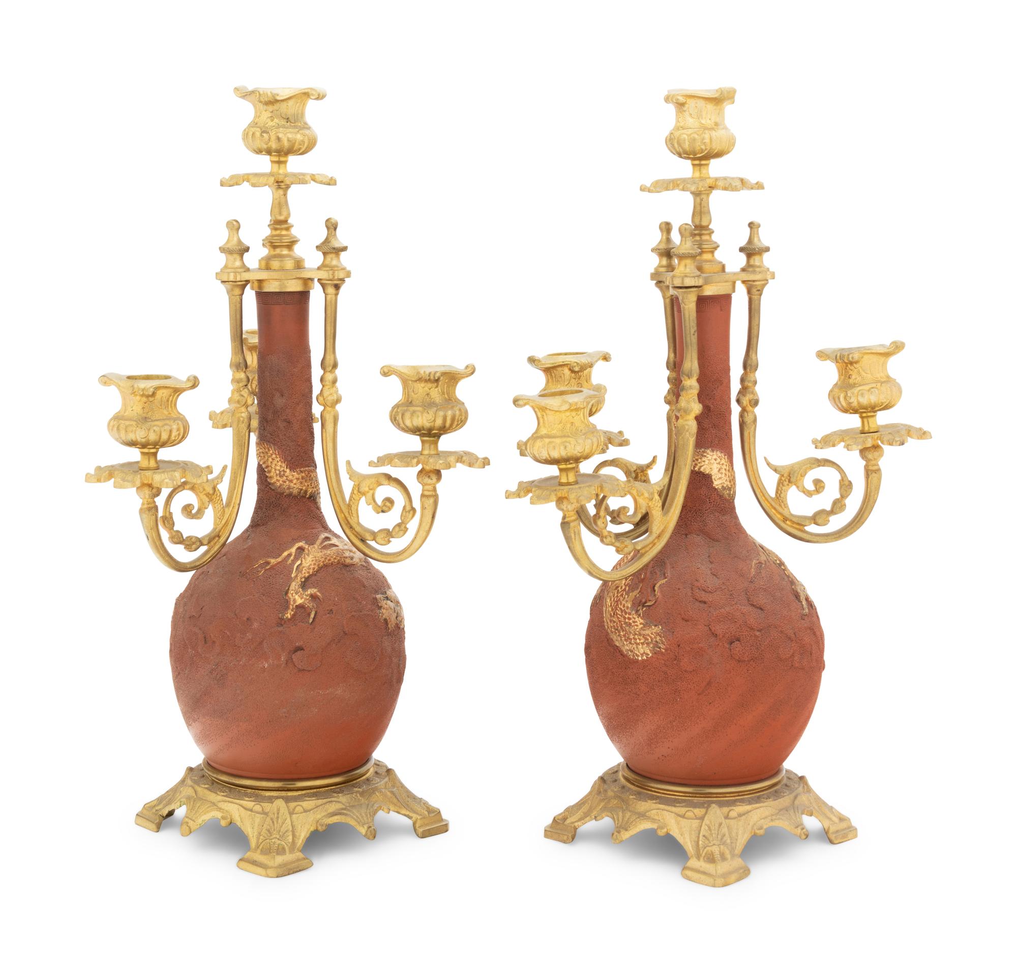A Pair of Japanese Gilt Bronze Mounted Parcel Gilt Ceramic Four-Light Candelabra