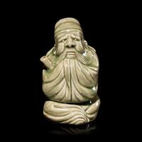 A Chinese Celadon Glazed Porcelain Figure Water Dropper, Yandi — 青釉人物形硯滴