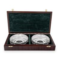 A Pair of Greek Silver Bottle Coasters