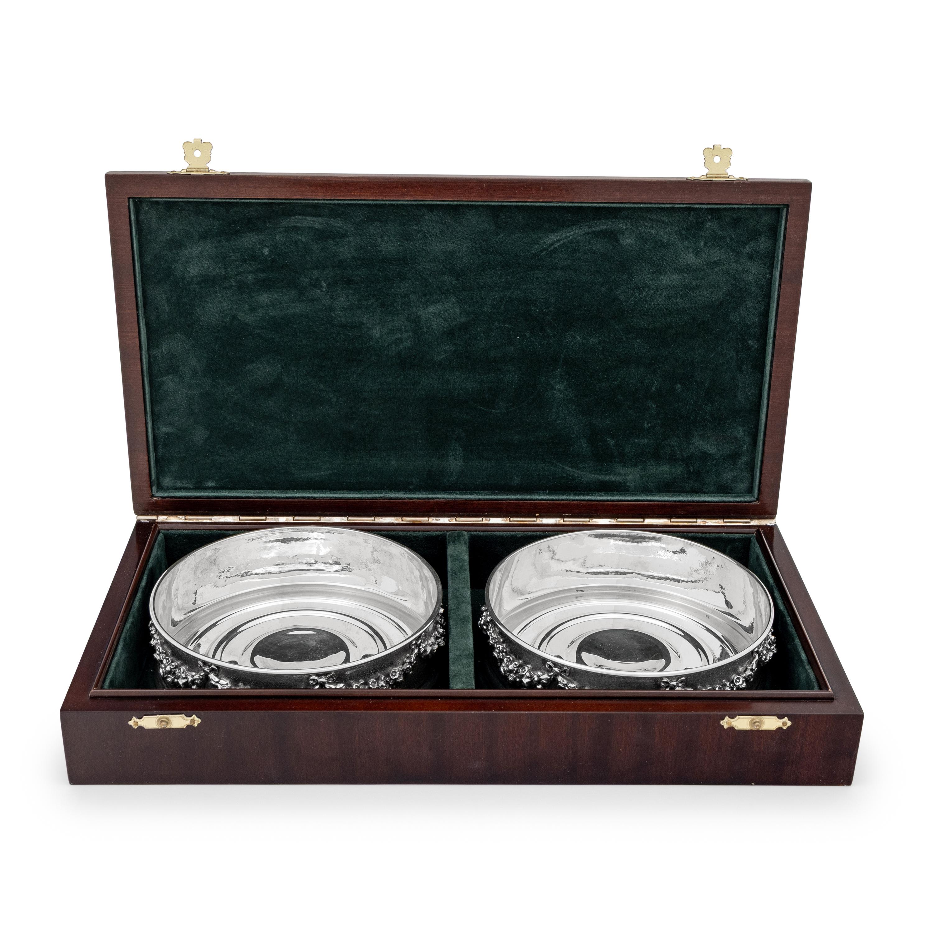 A Pair of Greek Silver Bottle Coasters
