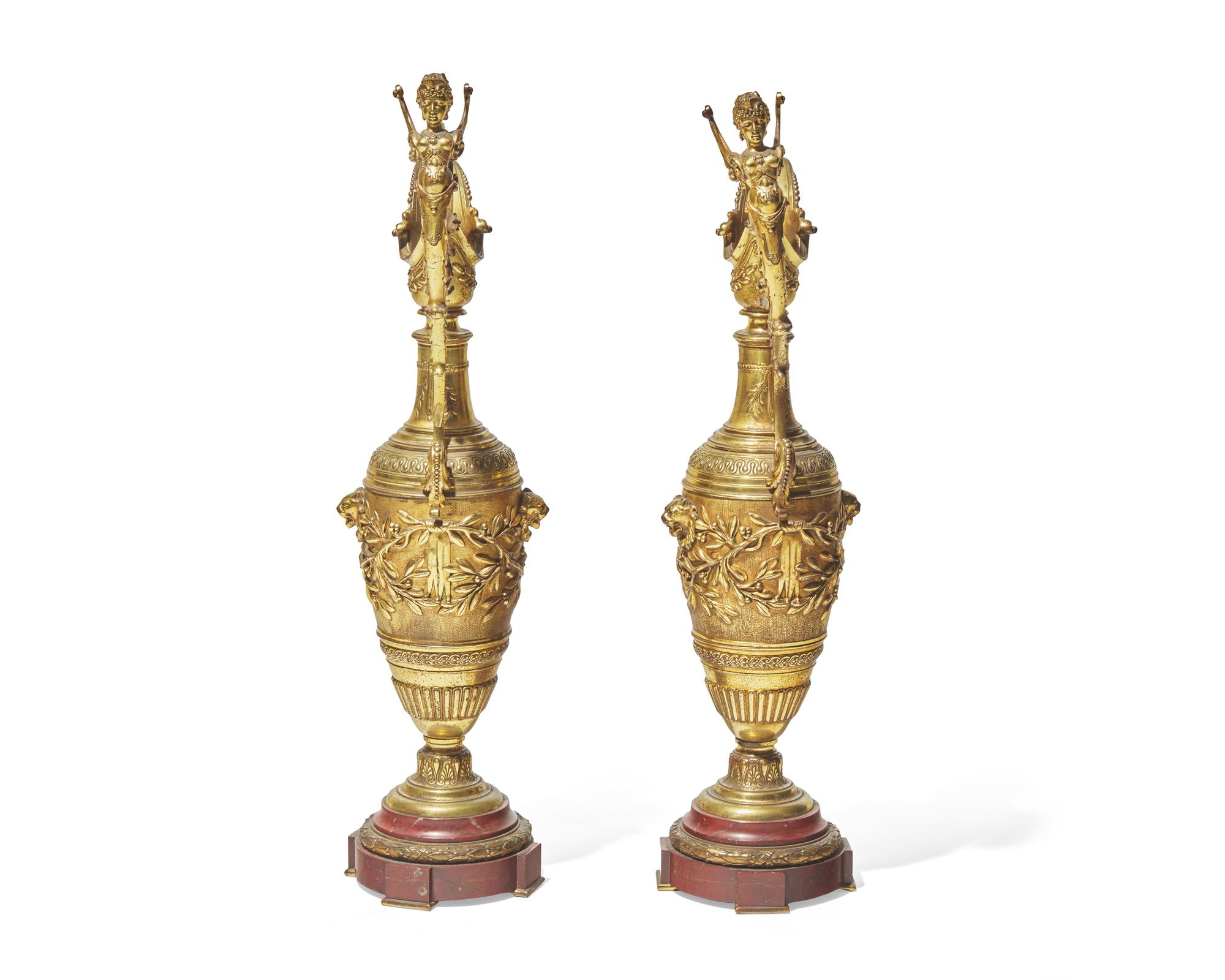 A pair of Renaissance Revival gilt bronze and rouge marble ewers, late 19th century