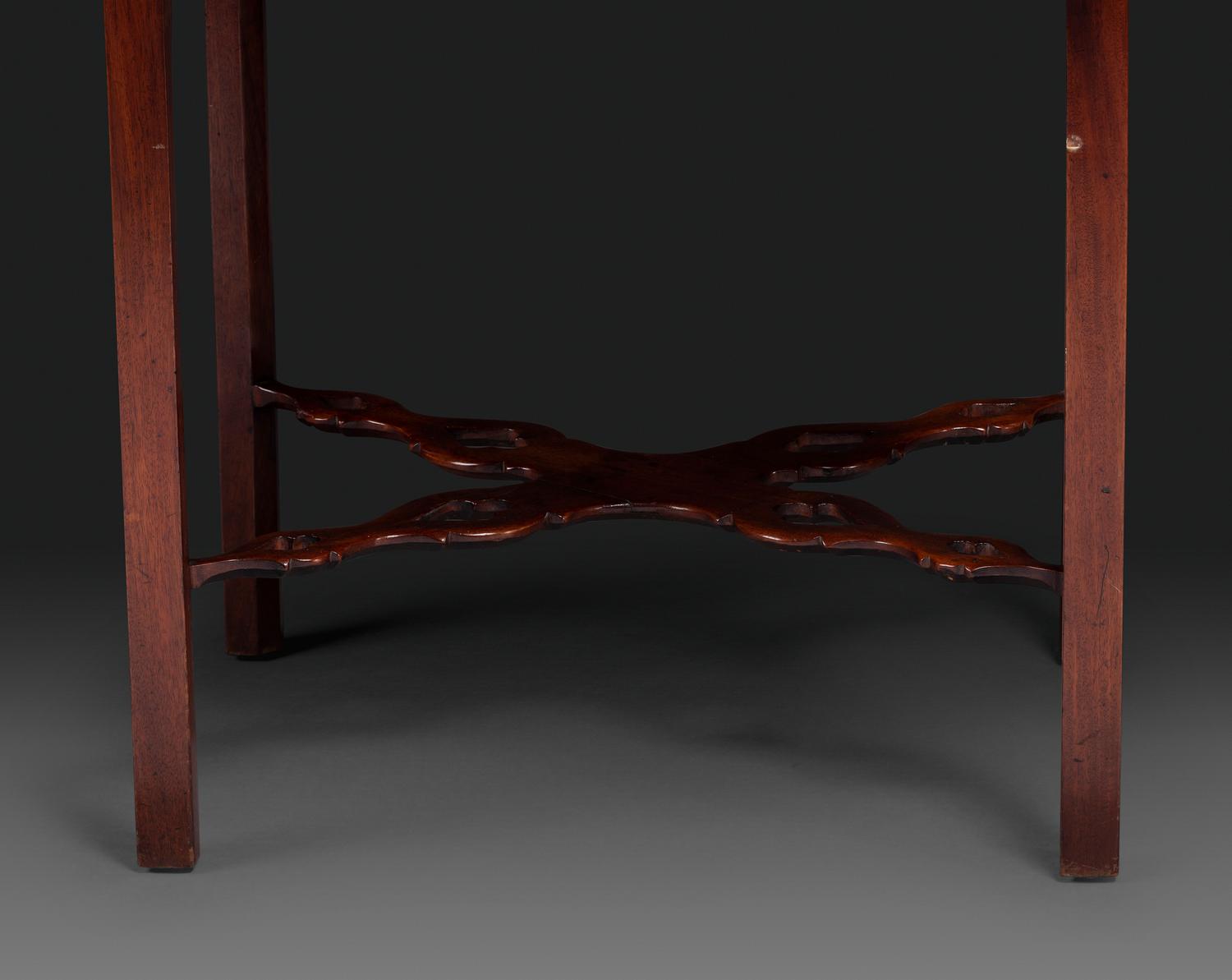 A Late Chippendale Carved and Figured Mahogany Stretcher-Base Pembroke Table