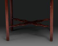 A Late Chippendale Carved and Figured Mahogany Stretcher-Base Pembroke Table