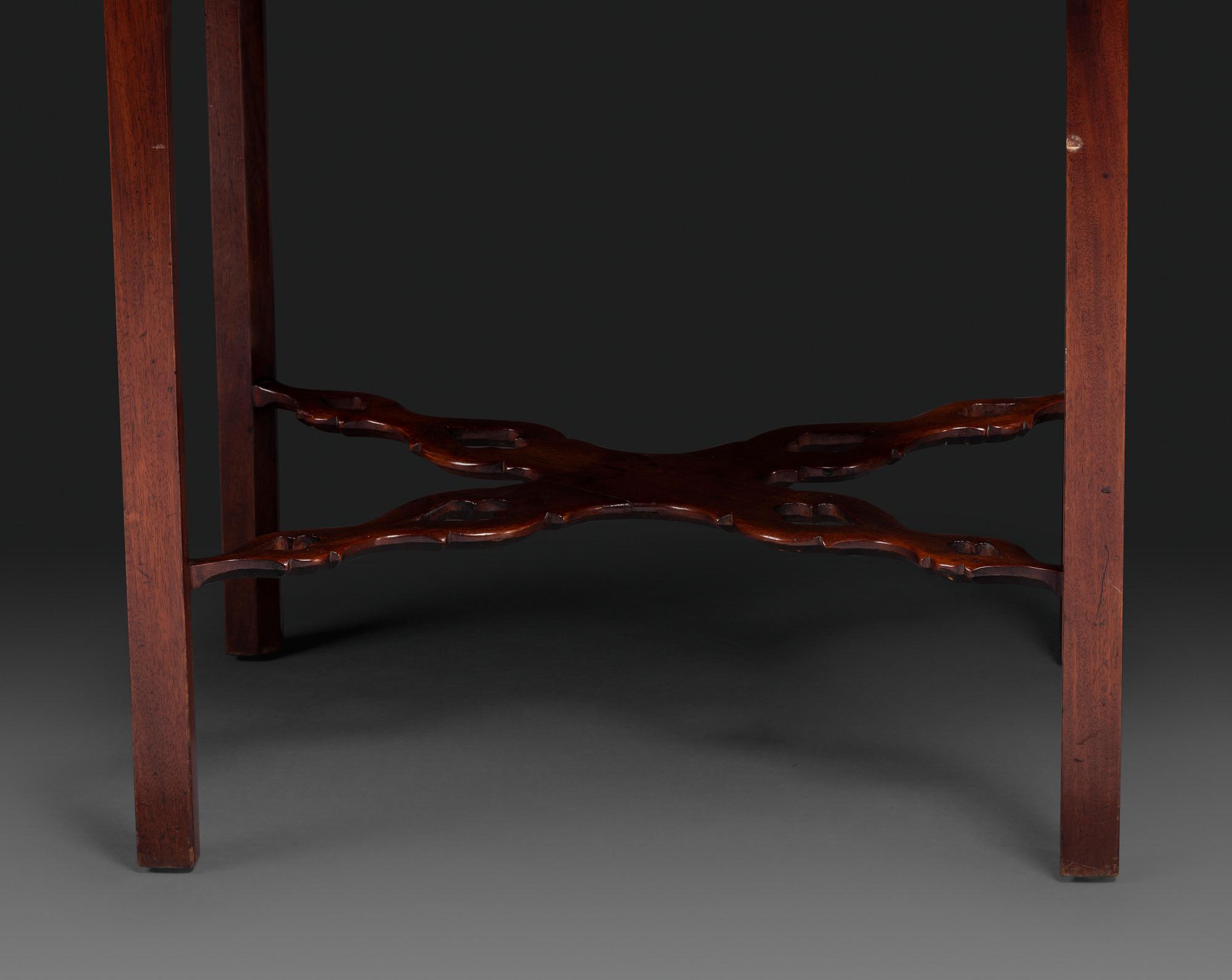 A Late Chippendale Carved and Figured Mahogany Stretcher-Base Pembroke Table