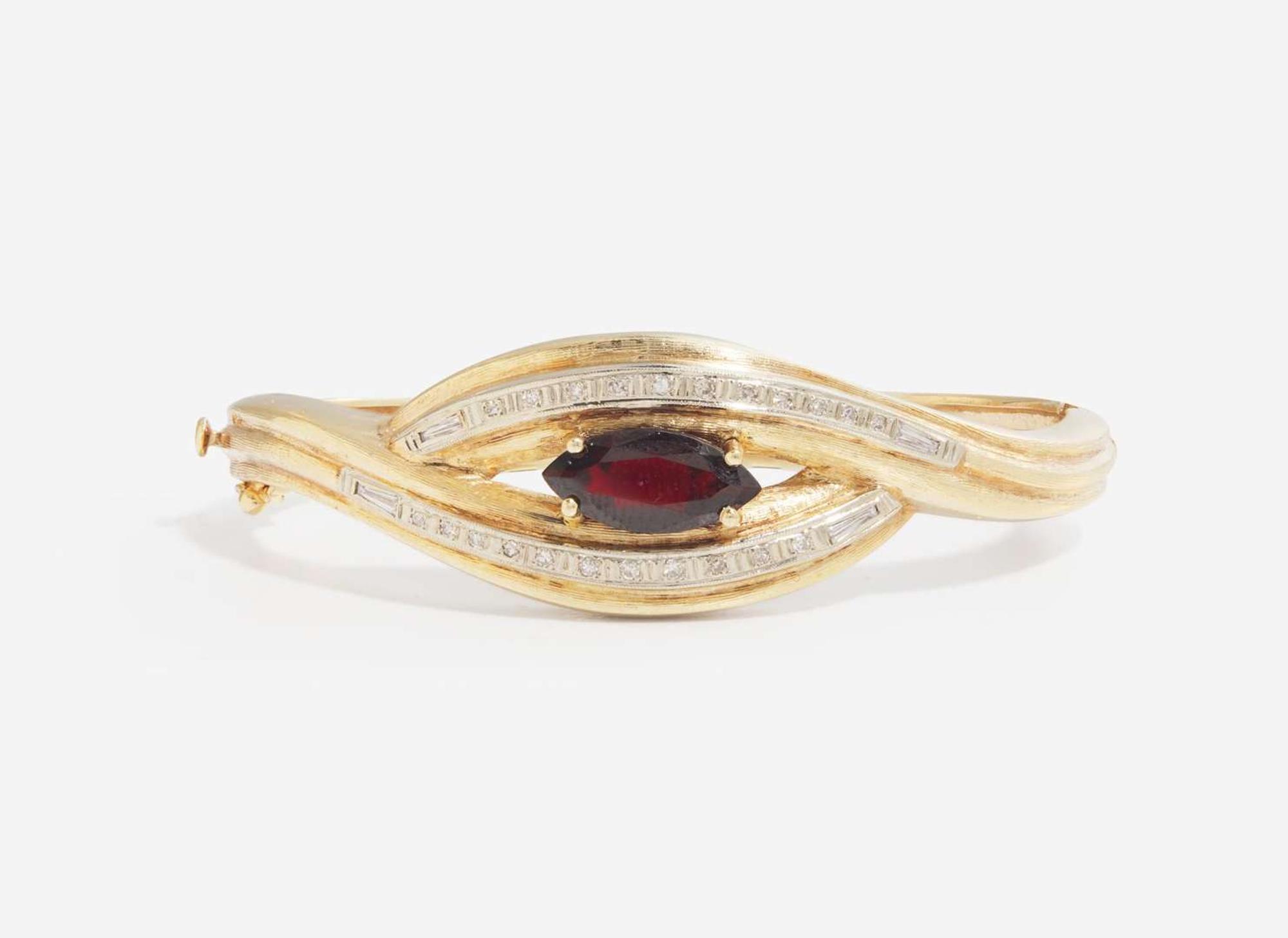A 14K Yellow Gold and Garnet Bangle Bracelet