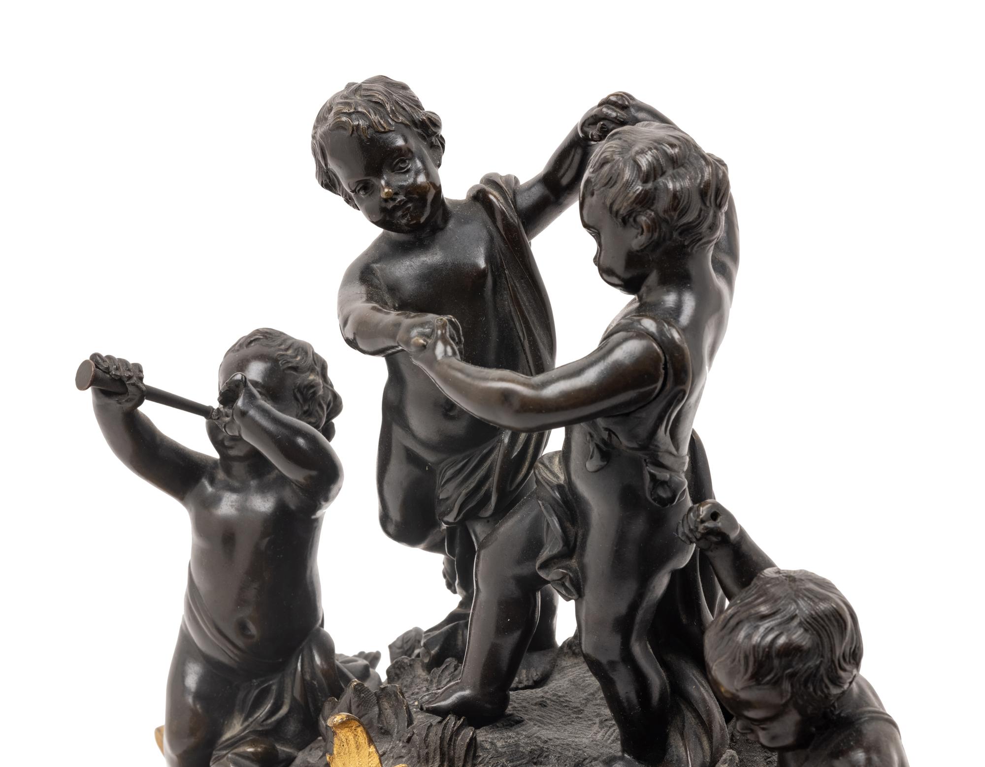 A French Gilt and Patinated Bronze Figural Mantel Clock