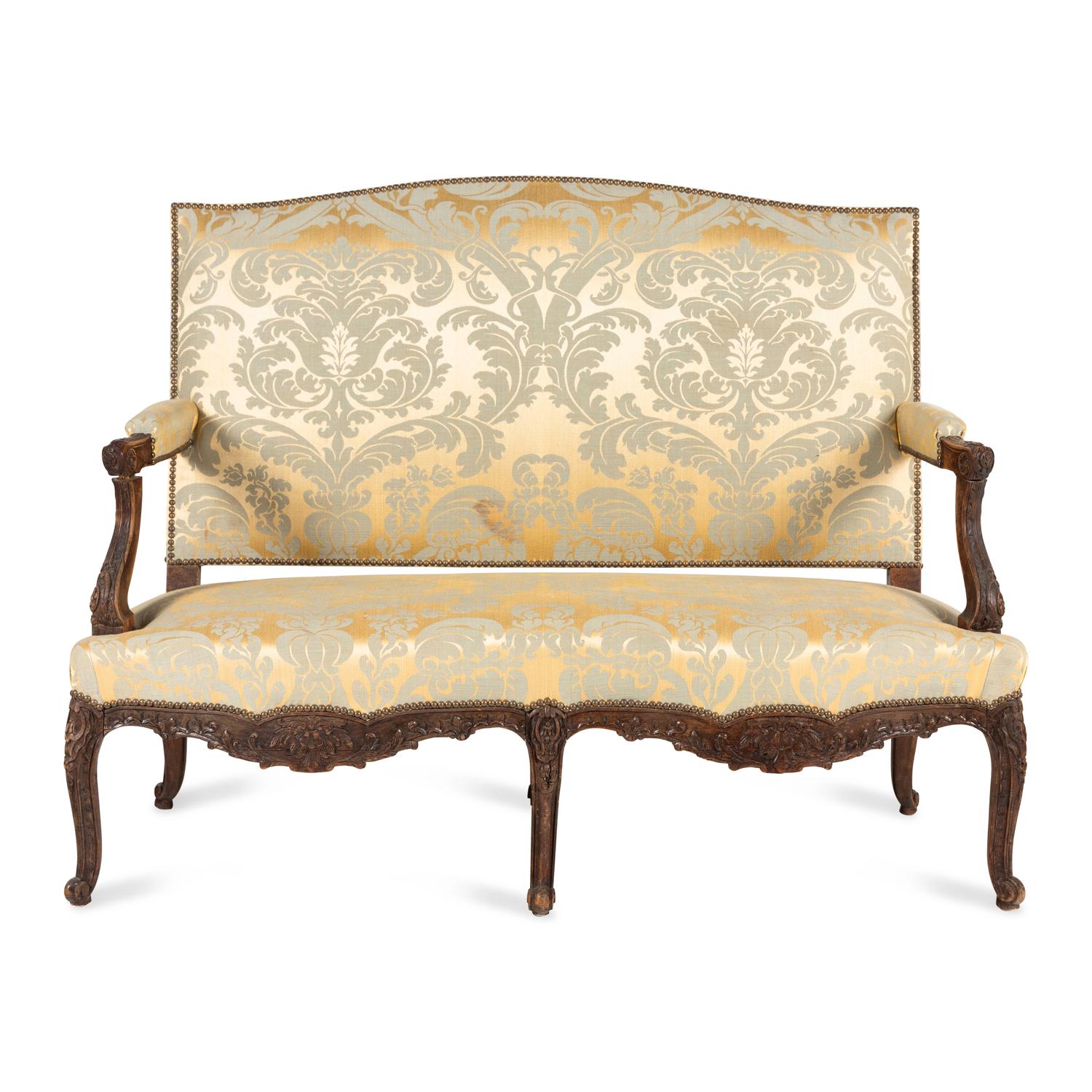 A Louis XV Style Carved Walnut and Silk Damask Upholstered Settee