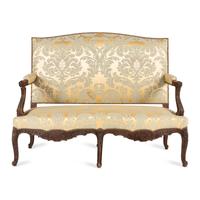 A Louis XV Style Carved Walnut and Silk Damask Upholstered Settee