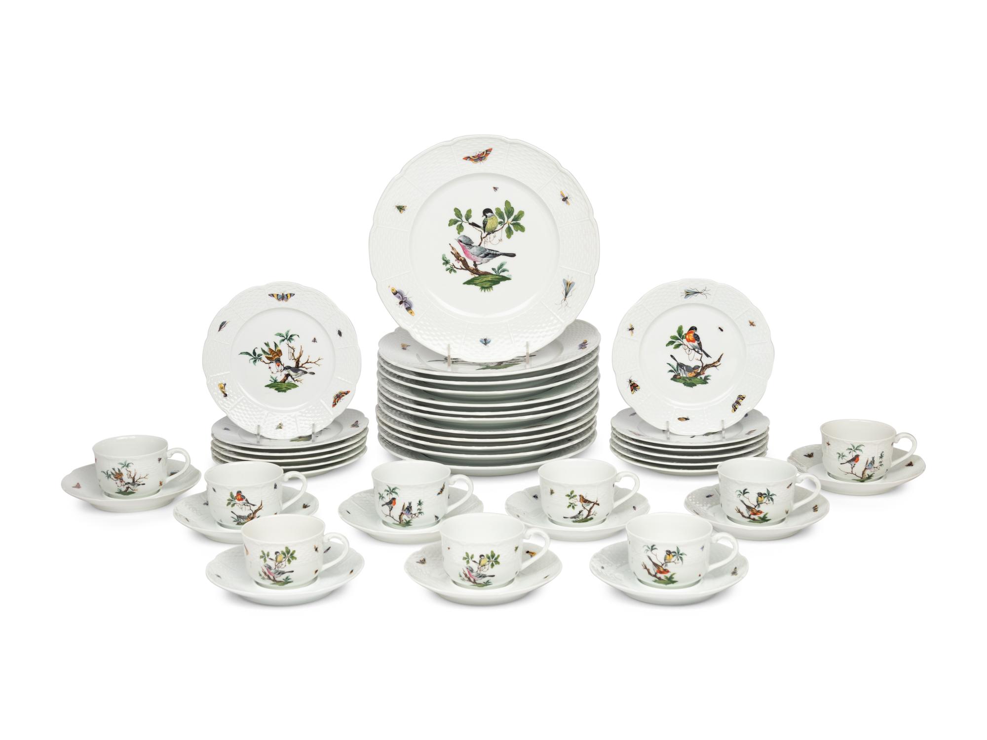 A Raynaud Limoges Porcelain Dinner Service