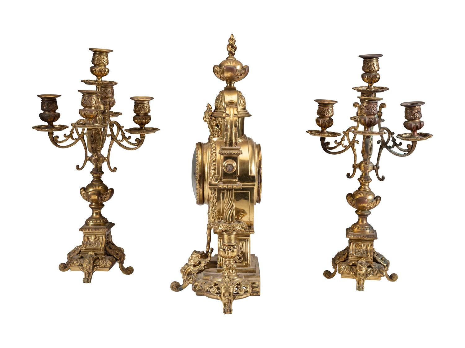 A Continental Gilt Bronze Three-Piece Clock Garniture