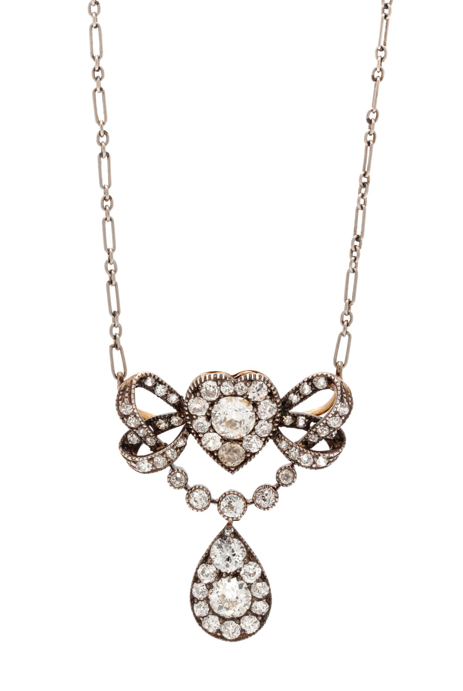 An Edwardian Silver Topped Gold and Diamond Convertible Pendant/Brooch, 5.50 dwts.