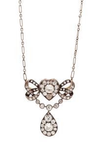 An Edwardian Silver Topped Gold and Diamond Convertible Pendant/Brooch, 5.50 dwts.