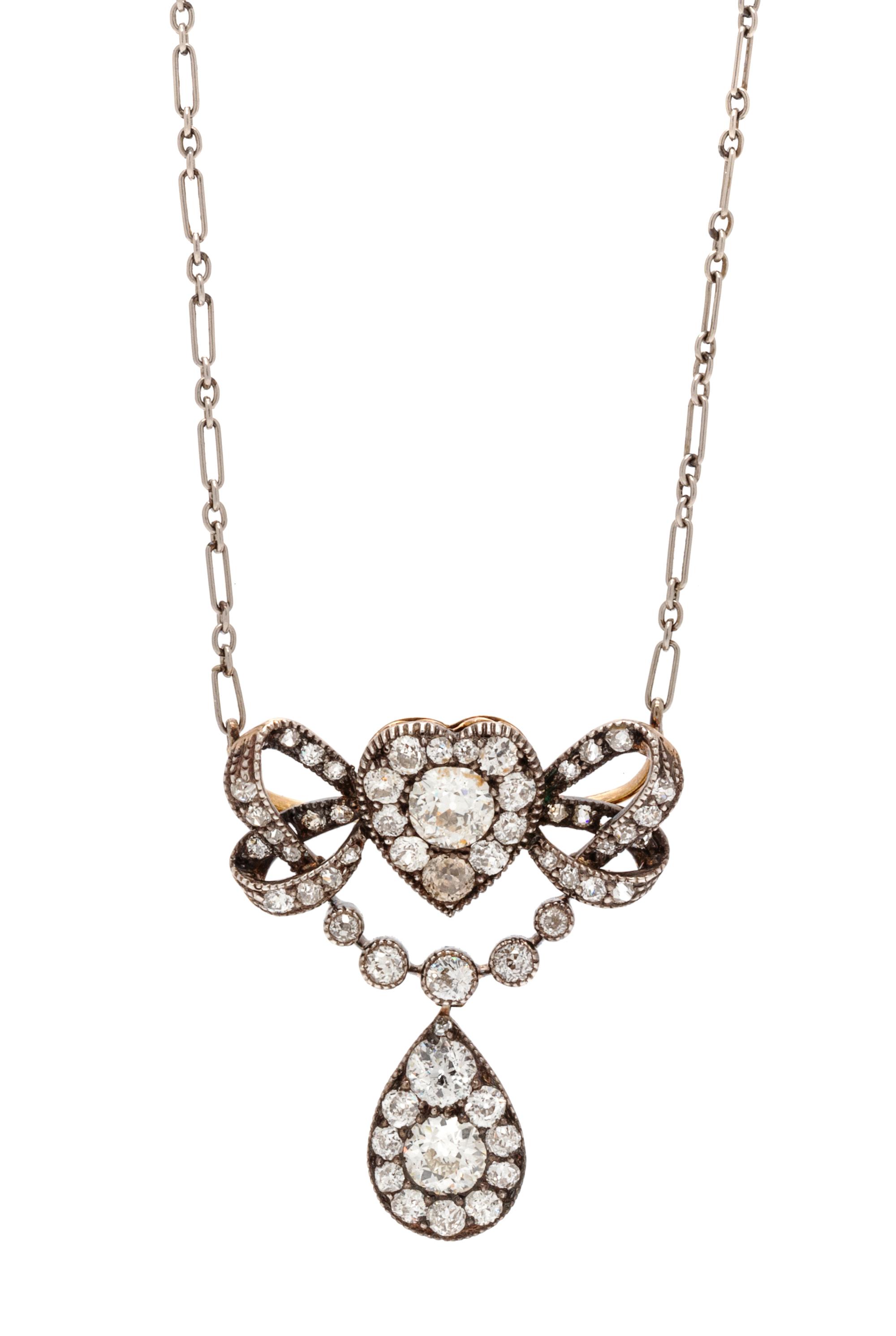 An Edwardian Silver Topped Gold and Diamond Convertible Pendant/Brooch, 5.50 dwts.