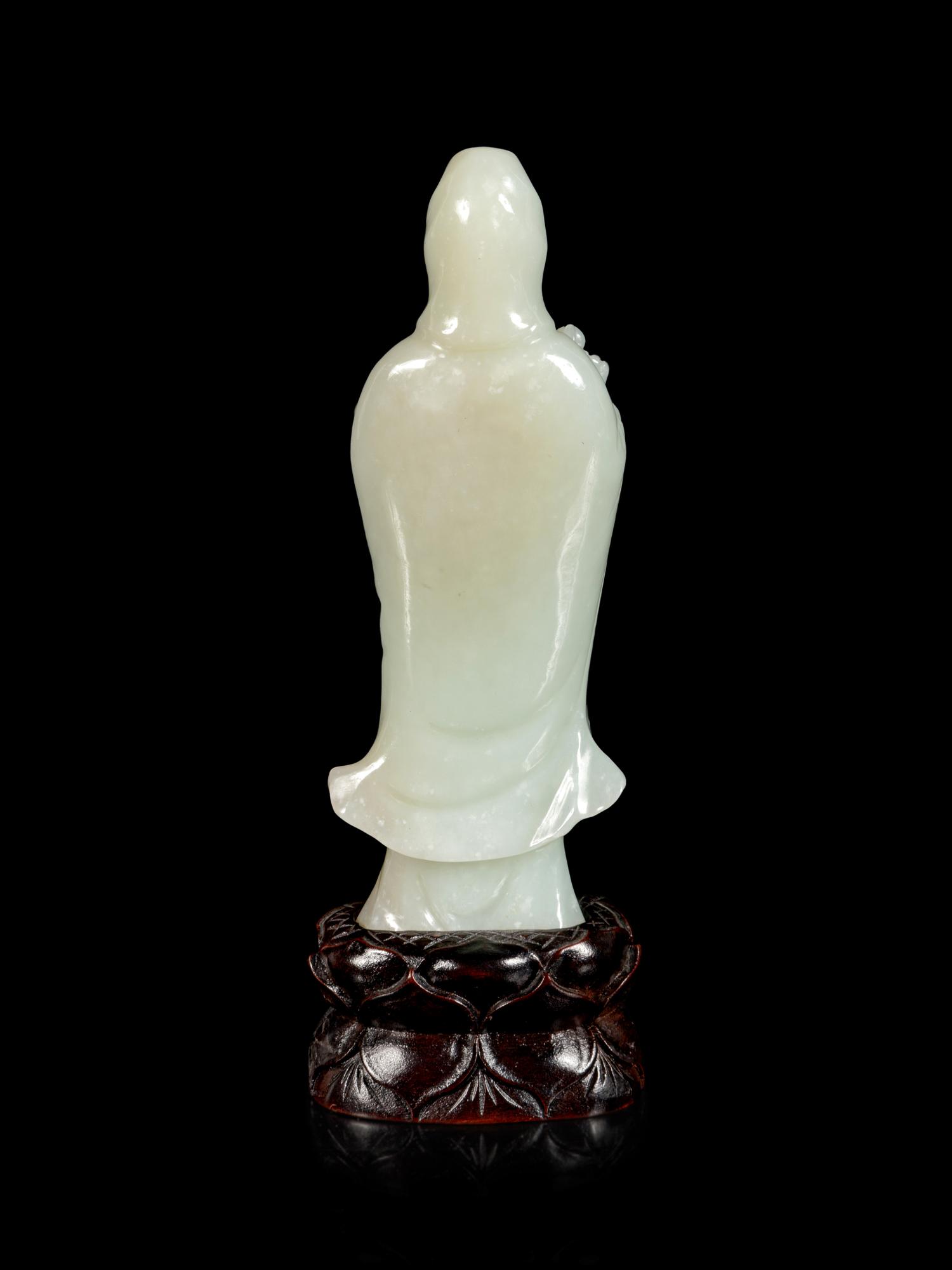 A Pale Celadon Jade Figure of Guanyin