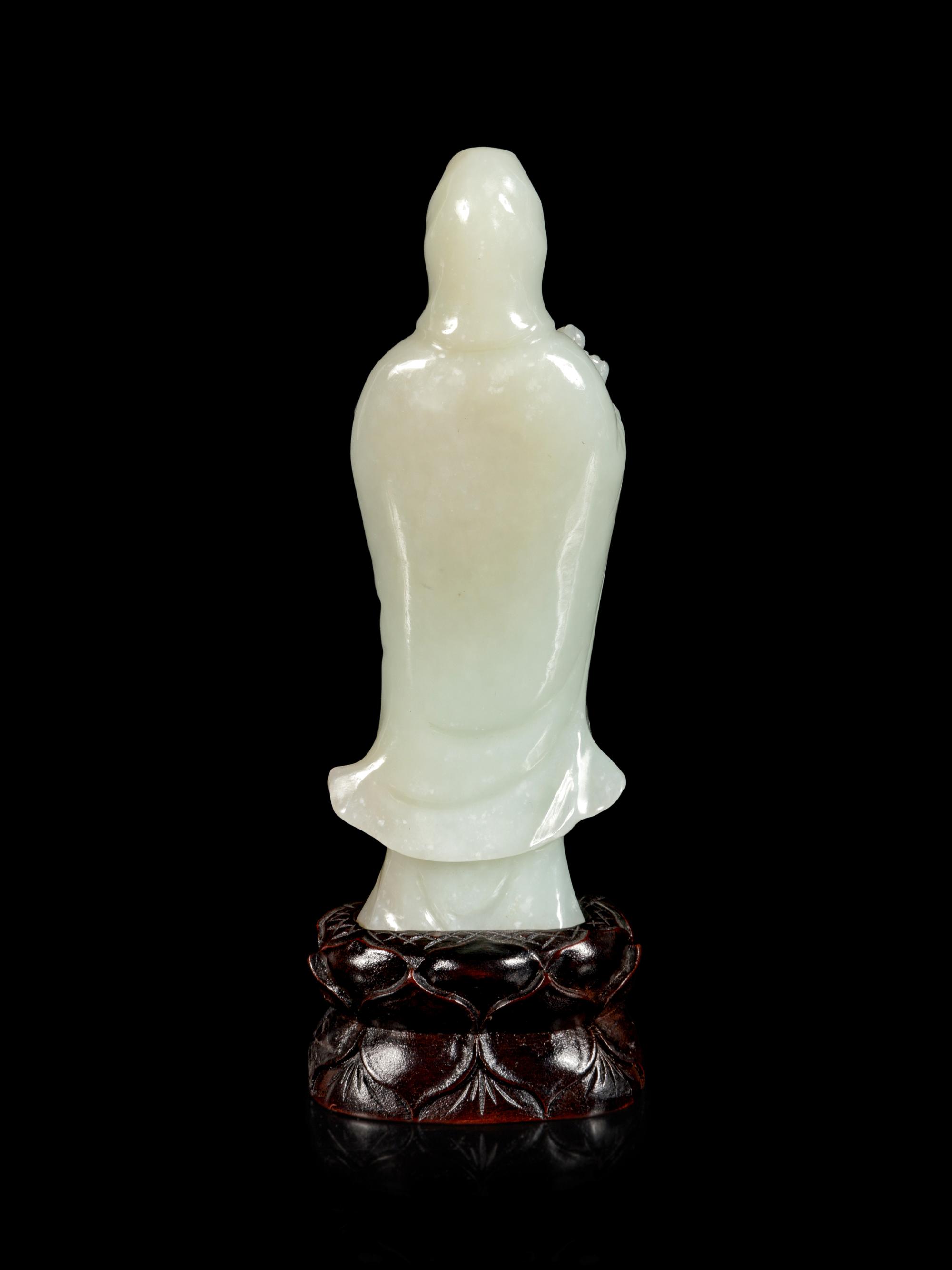 A Pale Celadon Jade Figure of Guanyin