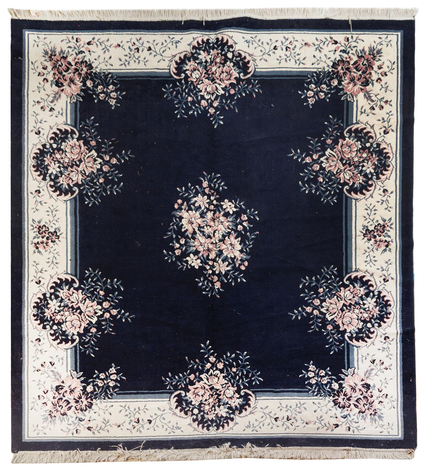 A Chinese Wool Rug 9 feet 1/2 inches x 7 feet 10 inches.