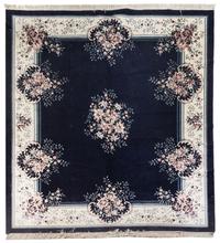 A Chinese Wool Rug 9 feet 1/2 inches x 7 feet 10 inches.