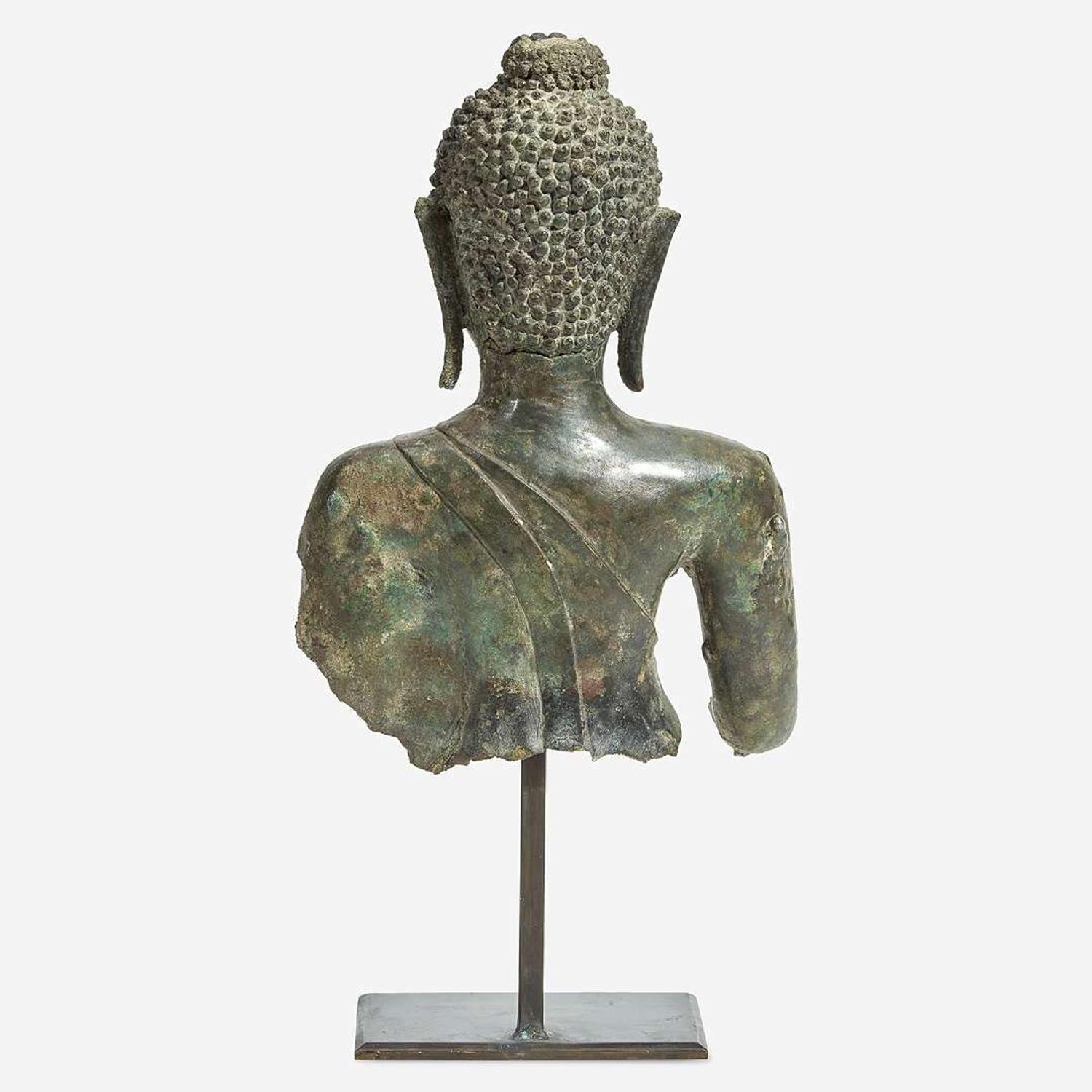 A Thai bronze head and torso of a Buddha 15th Century