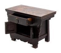 A Chinese Carved and Black Painted Wood Diminutive Chest