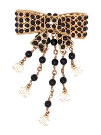 Six Chanel Brooches/Pins: Four Textile, One Snake Skin, One Metal