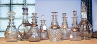 A Group of Eight Cut Glass Liquor Bottles Height of tallest 11 3/4 inches.