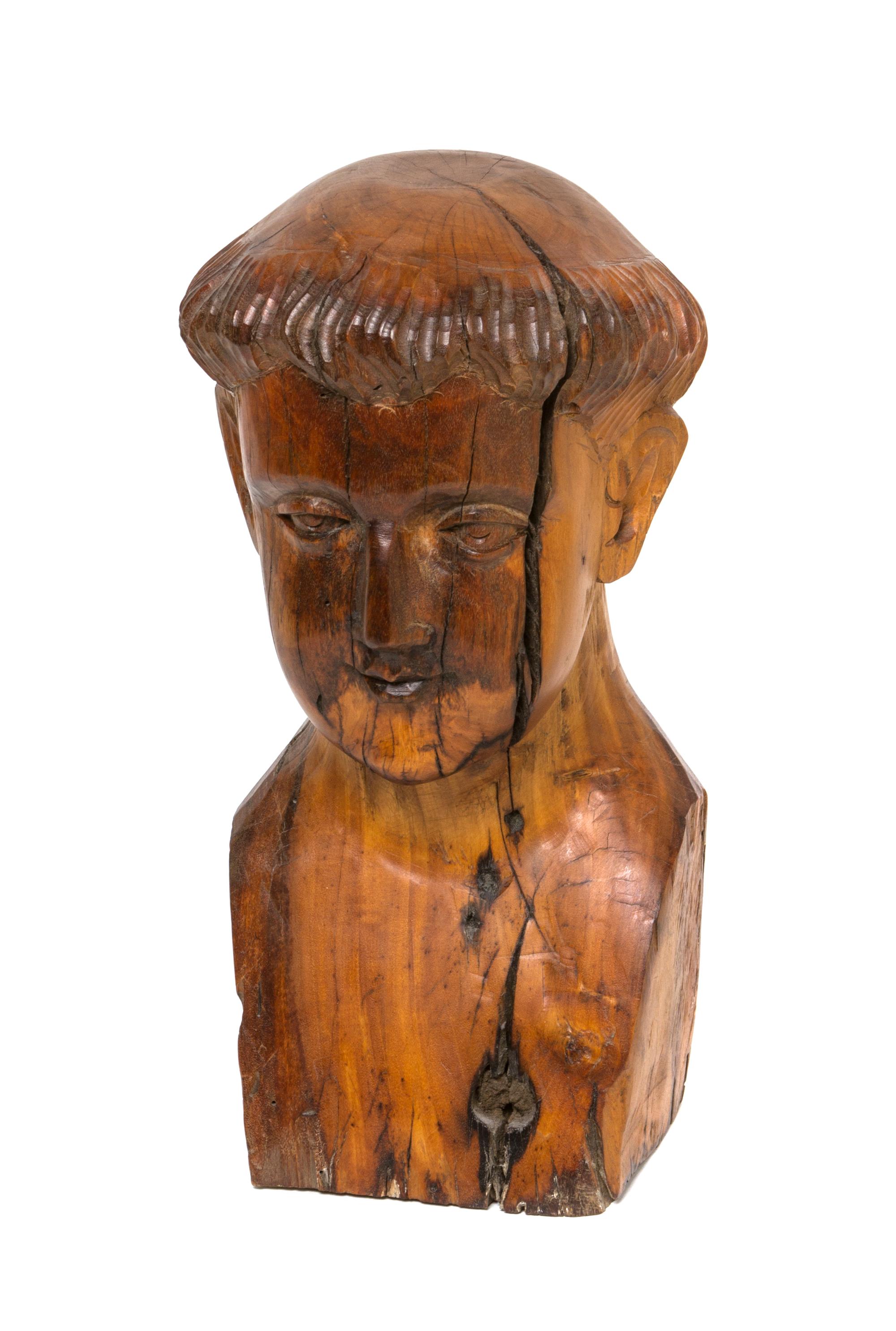 A Carved Walnut Bust, Height 13 1/2 inches.