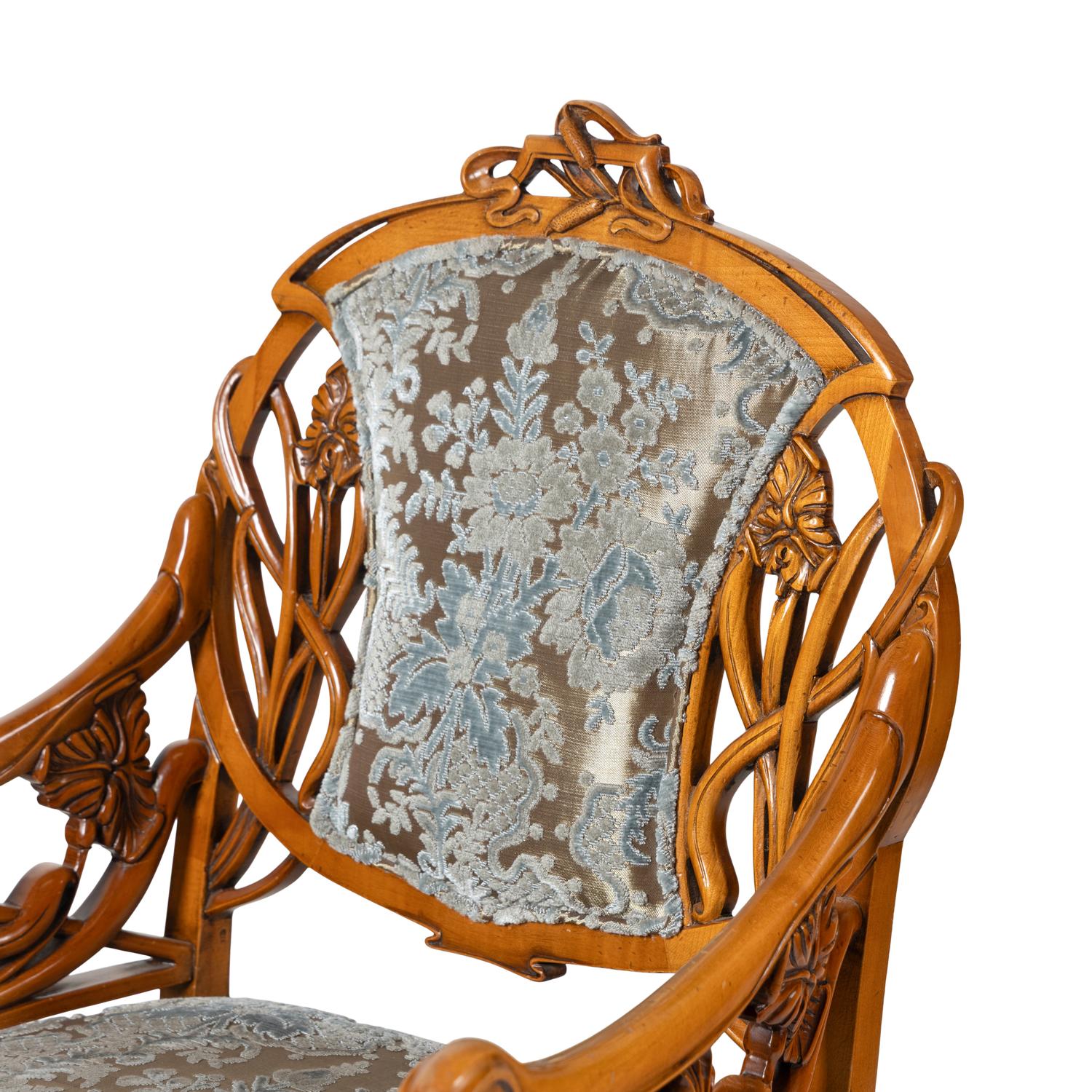 A Pair of Art Nouveau Style Carved Fruitwood Armchairs