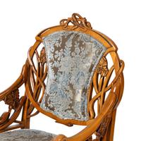 A Pair of Art Nouveau Style Carved Fruitwood Armchairs