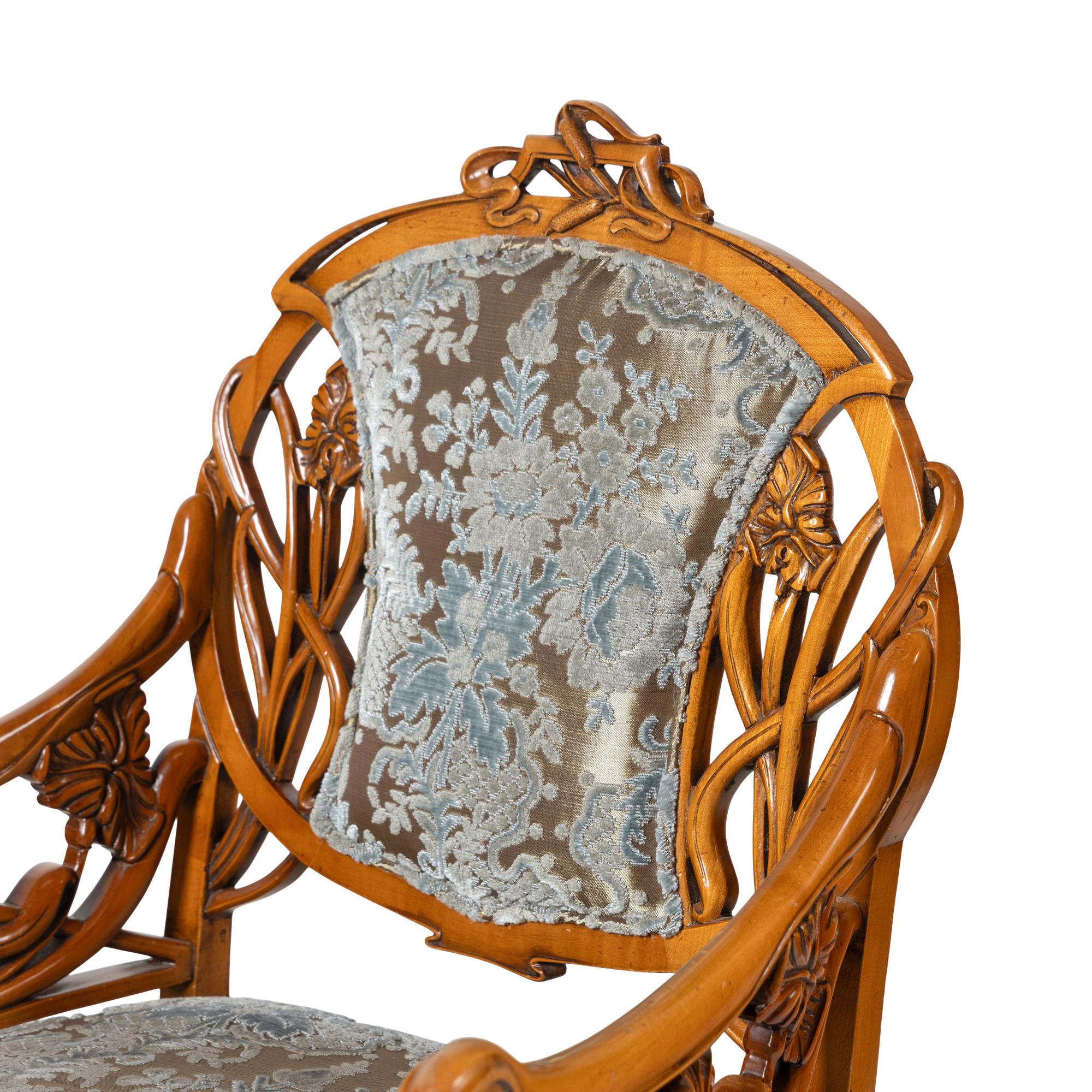 A Pair of Art Nouveau Style Carved Fruitwood Armchairs